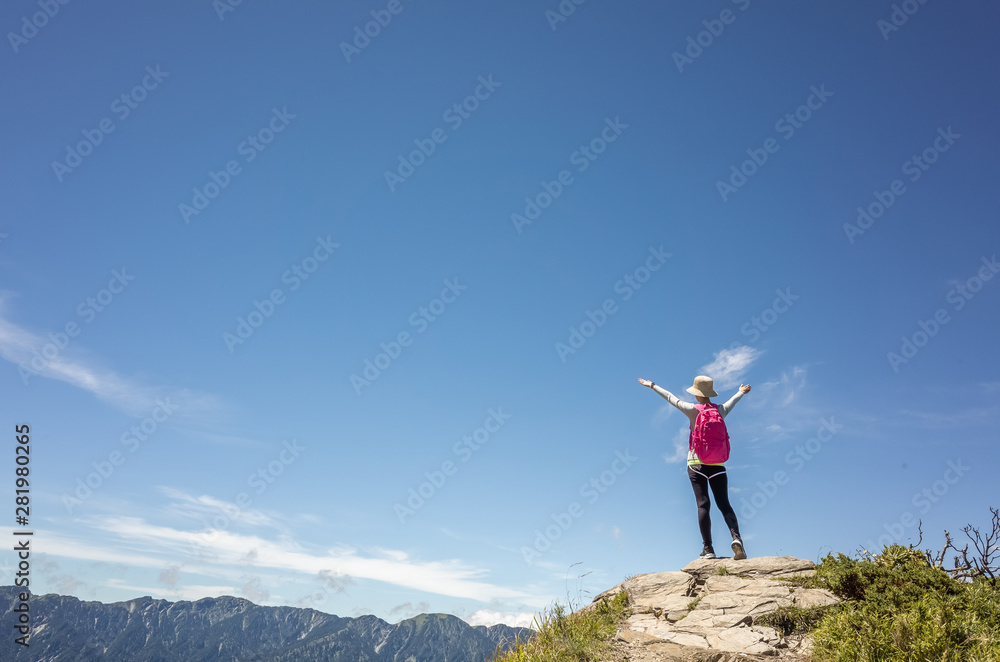 mountain climbing woman stretch and feel free