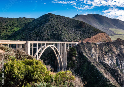 The Bixby Creek Bridge, or "Bixby Bridge" for short, was built along the Pacific Coast of the Monterey Bay in California, in Big Sur in 1932. California travel concept.