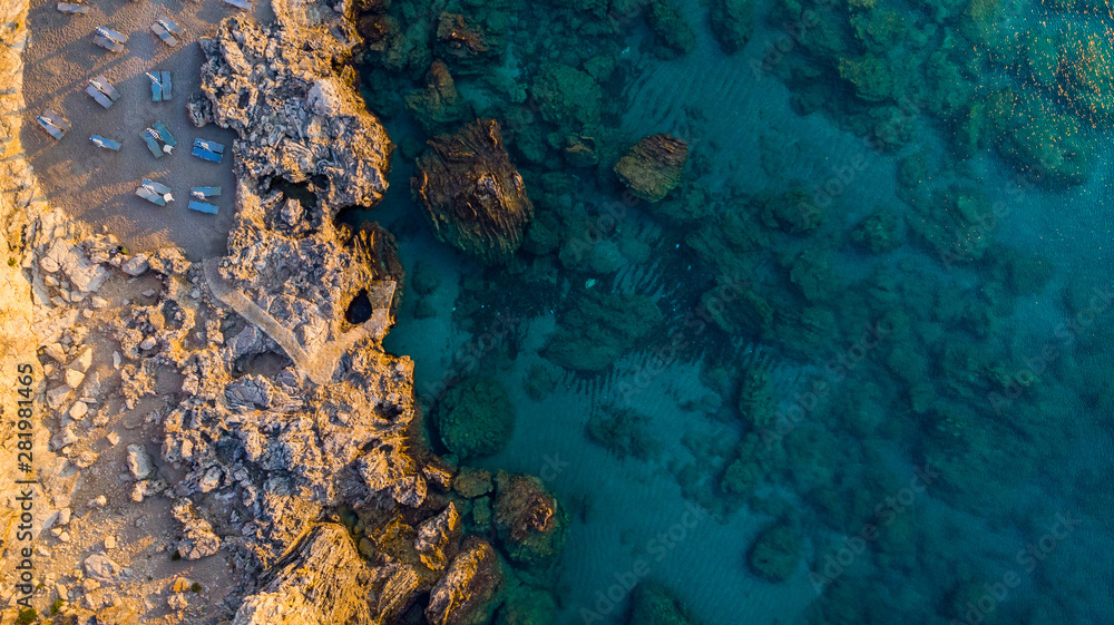 Secret Beach on Rocky Shore and Blue Waters, Greek Island, Drone View