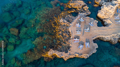 Sun Umbrella and Chairs on Beach At Mediterranean Sea, Drone Top Down View