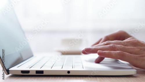 Woman freelancer working on laptop at home-office. Close up of female hands opening and closing computer with one hand. Businesswoman writing business letter at work. Dolly shot of typing on keyboard