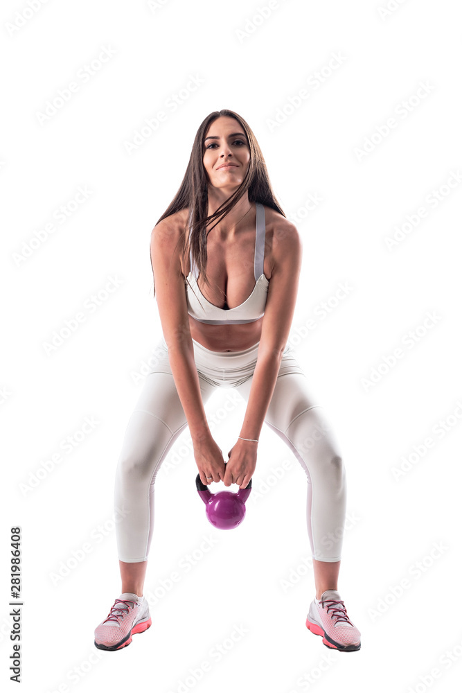 Action photo of attractive gym fitness woman weightlifting with kettlebell. Front view. Full body isolated on white background. Action photo of attractive gym fitness woman weightlifting with kettlebell. Front view. Full body isolated on white background.