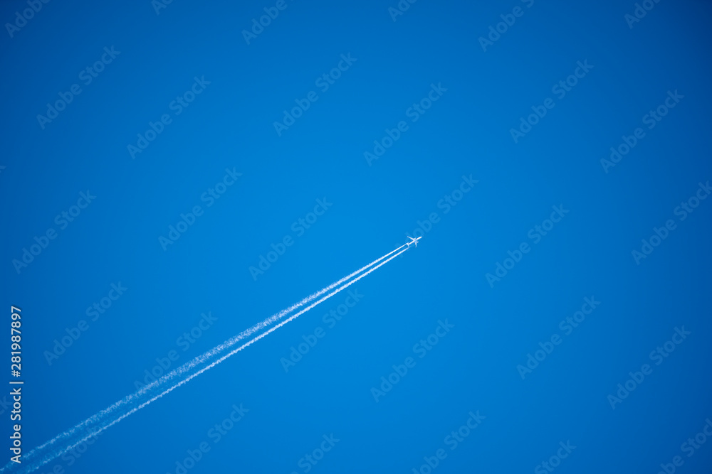 Airplane in the sky. An airplane trail across the sky Airplane in the sky. An airplane trail across the sky