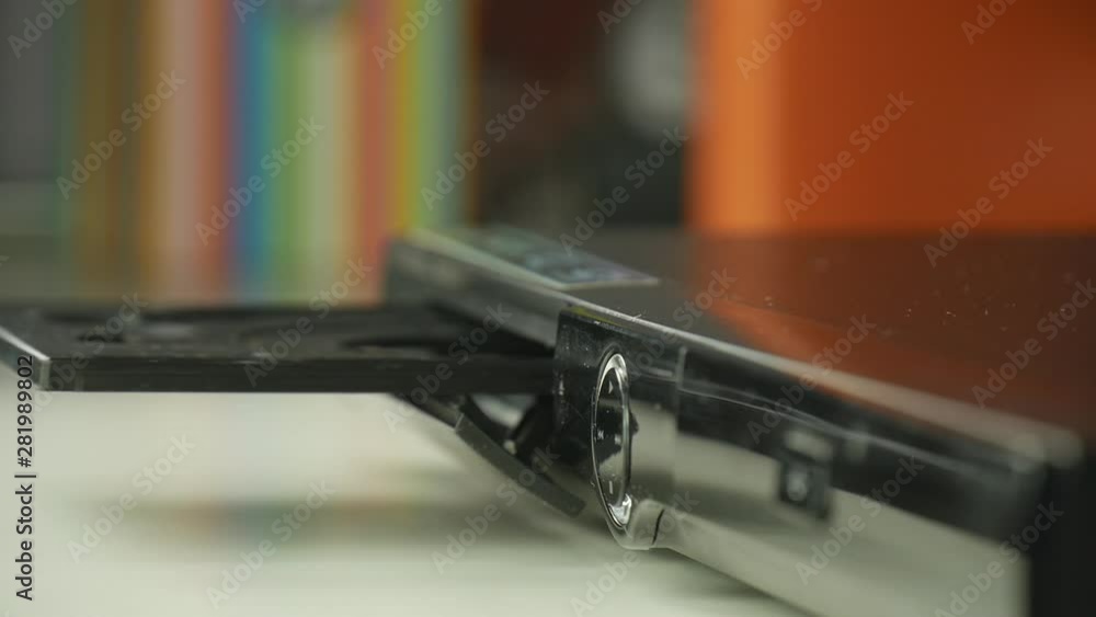 Slow Motion Shooting with Man Hand Inserting CD in a Player Slow Motion Shooting with Man Hand Inserting CD in a Player