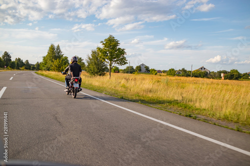 Motorcyclist biker driving on the highway
