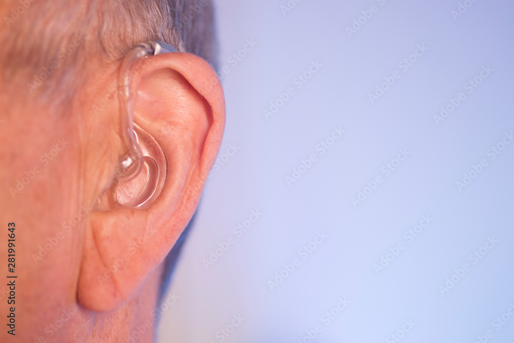 Man with hearing aid Man with hearing aid