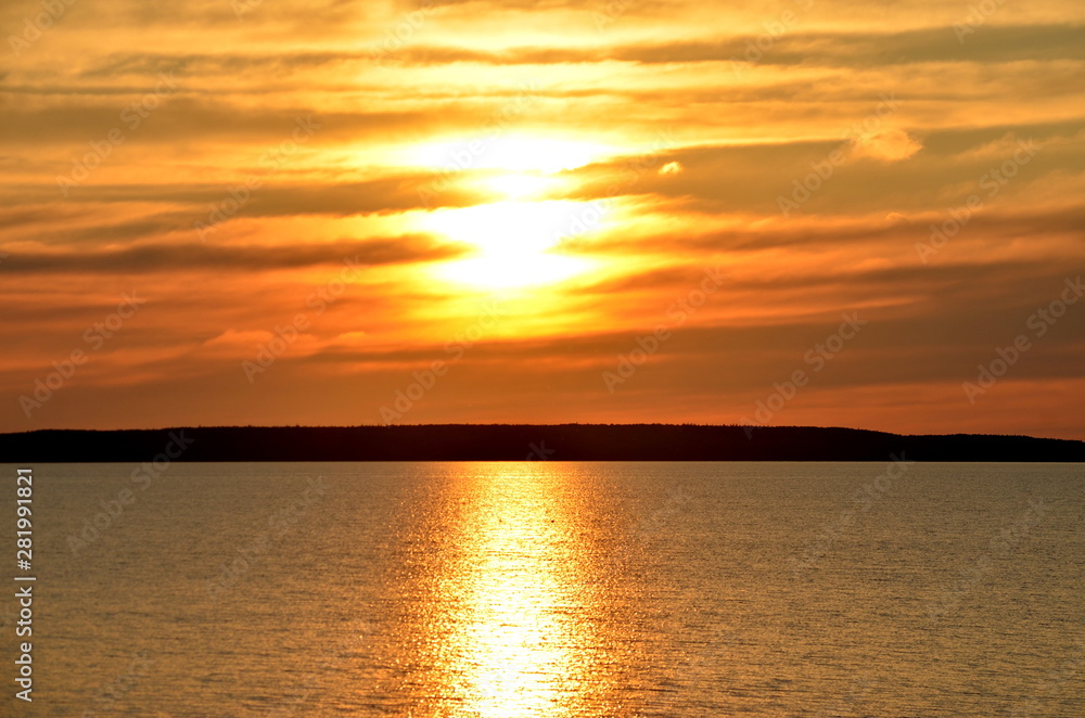 Sunset over water in Saskatchewan, Canada Sunset over water in Saskatchewan, Canada