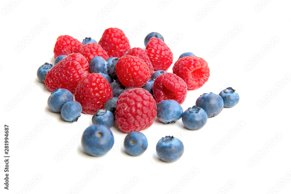 Mix berries isolated on white background. Ripe raspberry and blueberries. Mix berries isolated on white background. Ripe raspberry and blueberries.