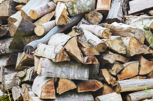 Stack of firewood for the drown in fireplace in the cold season_