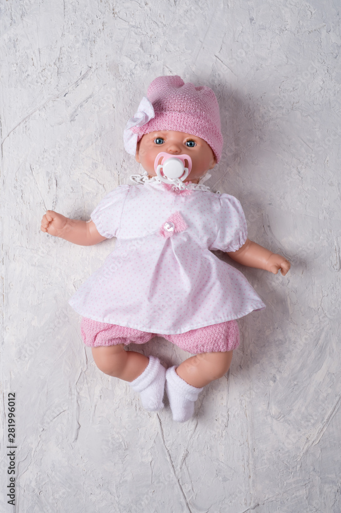 cute baby doll tot with dummy around white background cute baby doll tot with dummy around white background