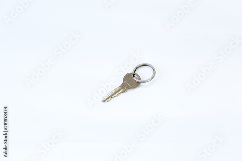 metal key on white ground © ali