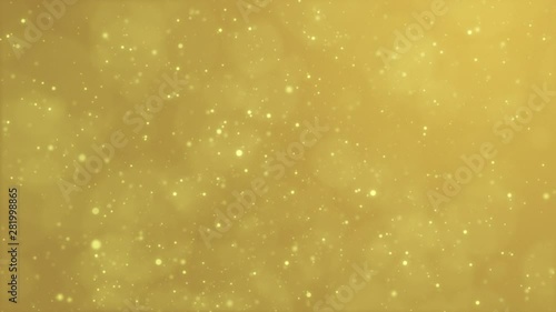 Shimmering gold Christmas particles on golden background, glowing dust flying in space