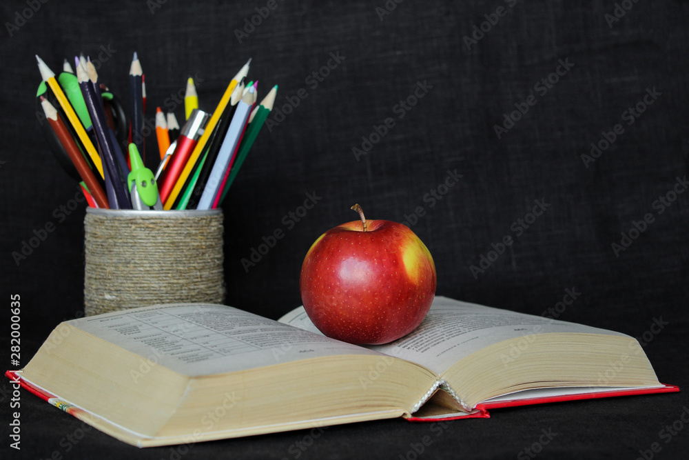 Back to school concept with school supplies with apple with copy space of text Back to school concept with school supplies with apple with copy space of text