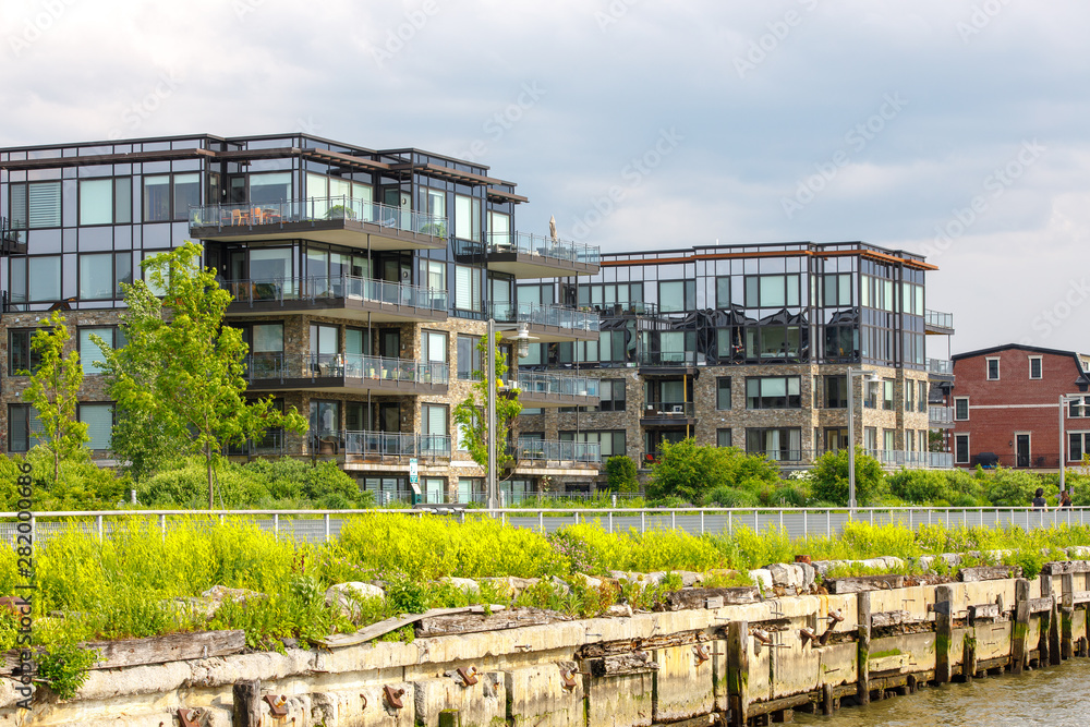 Obraz premium new development residential area, riverfront architecture in new york