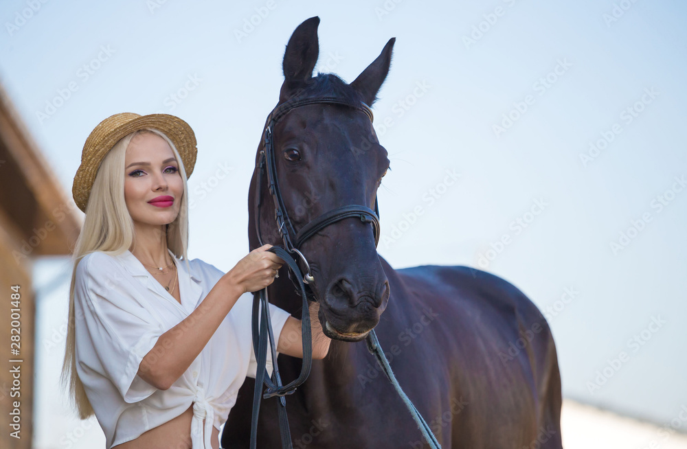 Obraz premium Woman and horse. Close up
