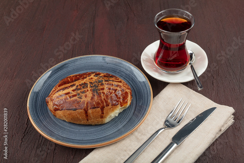 Turkish pastry product , tasty cheese pogaca. Turkish Pastries; pogaca, borek, acma, served on wooden table. photo