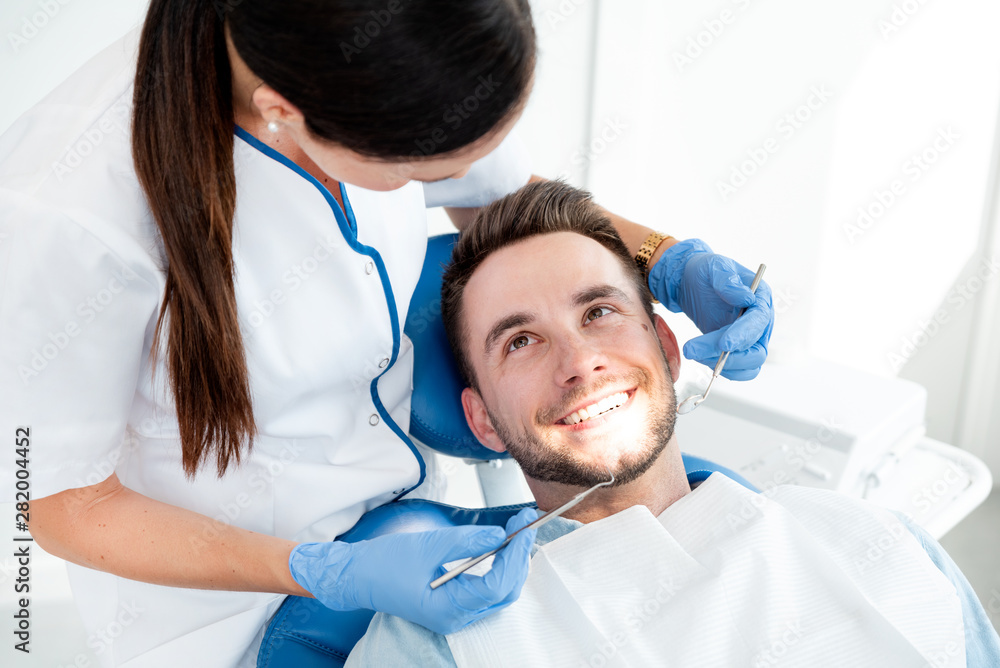 © Proxima Studio - Man having teeth examined at dentists © Proxima Studio - Man having teeth examined at dentists