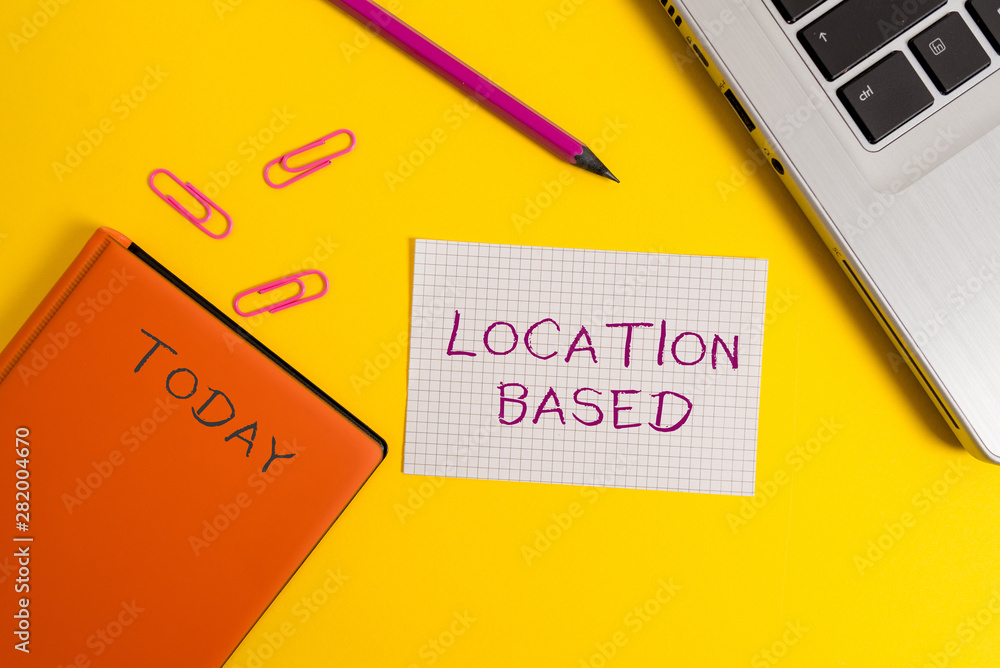 Handwriting text writing Location Based. Conceptual photo Mobile marketing to target users within same geographic area Laptop clips pencil paper sheet hard cover notebook colored background Handwriting text writing Location Based. Conceptual photo Mobile marketing to target users within same geographic area Laptop clips pencil paper sheet hard cover notebook colored background