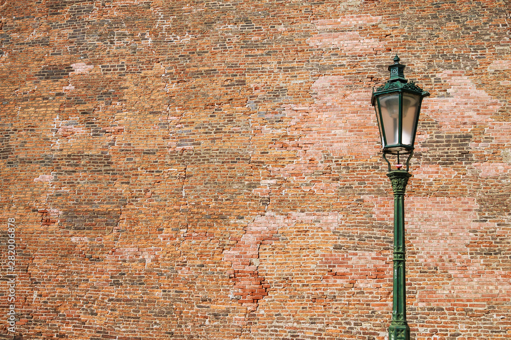 Street lamp on brick wall background