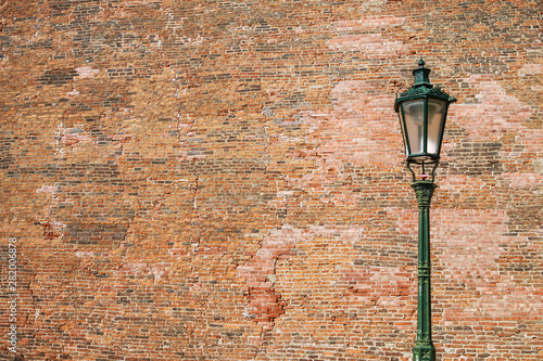 Street lamp on brick wall background