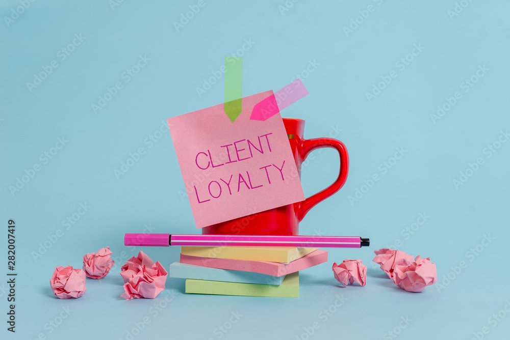 Writing note showing Client Loyalty. Business concept for The result of consistently positive satisfaction to clients Coffee cup pen note banners stacked pads paper balls pastel background