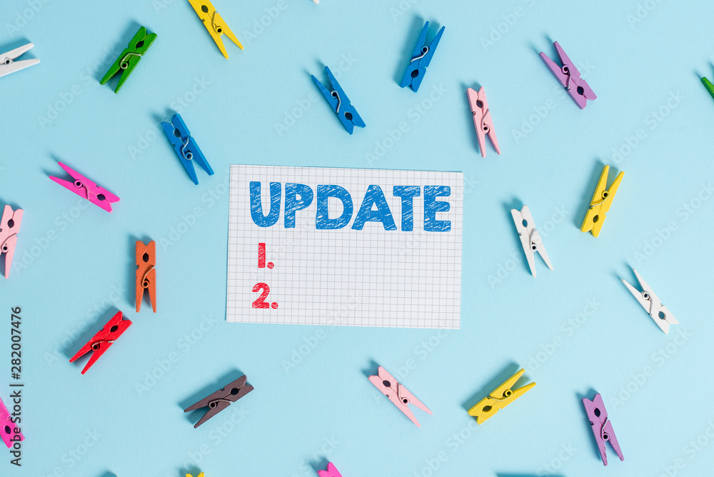 Handwriting text writing UPDATE. Conceptual photo make something more modern or up to date like software program Colored clothespin rectangle shaped reminder paper light blue background Handwriting text writing UPDATE. Conceptual photo make something more modern or up to date like software program Colored clothespin rectangle shaped reminder paper light blue background