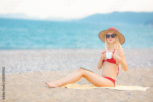 young girl sunbathing at the beach