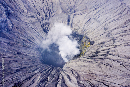 Beautiful Mount Bromo crater with volcanic smoke