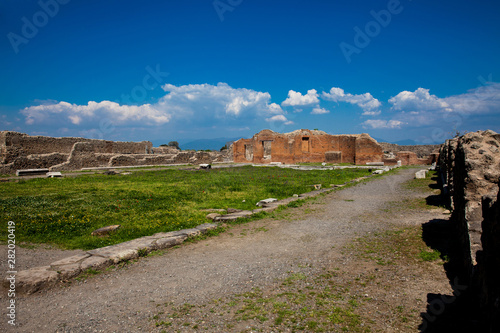 Ruins of the Building of Eumachia in the ancient city of Pompeii in a beautiful early spring day photo