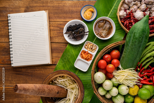 Som tum , and papaya salad ingredients on wooden table, top view , space for text input