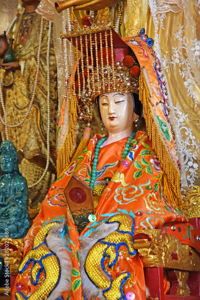Colorful Taoist goddess sculpture of Queen Mother of the West (Xiwangmu) in Taoist temple in Phuket, Thailand. Selective focus.