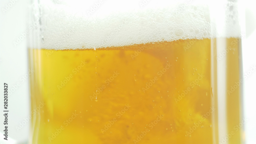 craft beer is poured into a glass on an isolated background craft beer is poured into a glass on an isolated background