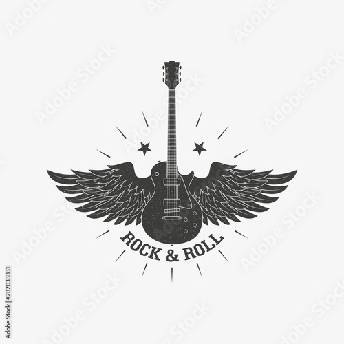 Guitar with wings and stars with rays with a grunge texture. Illustration on the theme of rock music.