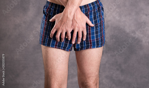 man in blue plaid boxer shorts