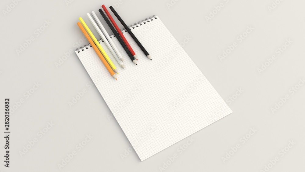 Notebook with colorful pencils