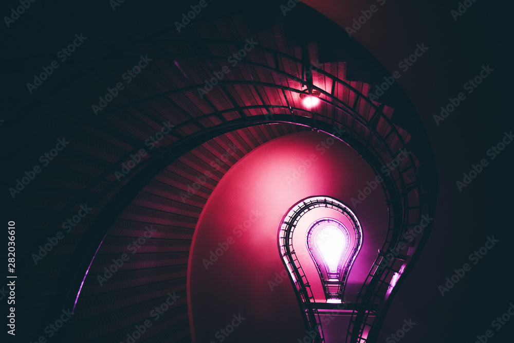 Pink spiral staircase. Lightbulb shaped staircase in Prague.  - obrazy, fototapety, plakaty 