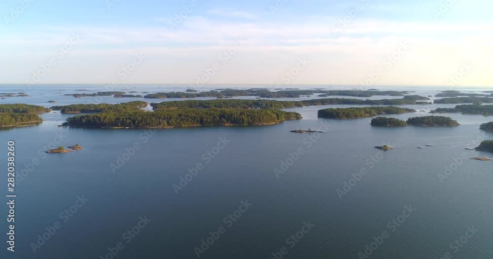 Finnish archipelago, Aerial, drone shot towards a group of islands, in the saaristo, on the Baltic sea, on a sunny, summer evening, in Tammisaari national park, in Raasepori, Uusimaa, Finland Finnish archipelago, Aerial, drone shot towards a group of islands, in the saaristo, on the Baltic sea, on a sunny, summer evening, in Tammisaari national park, in Raasepori, Uusimaa, Finland