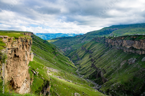 Mountain landscape in summer Sunny day blue cloudy sky