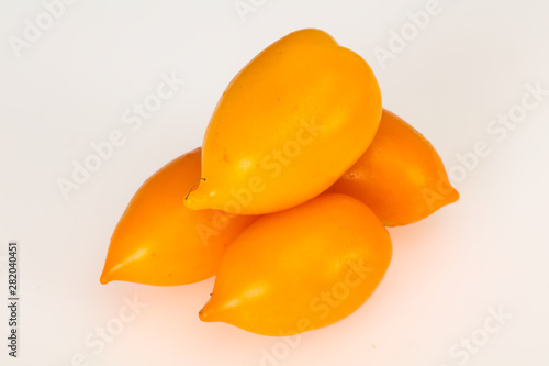 Ripe Yellow tomato isolated on white