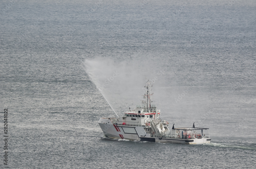 SAFETY AT SEA - Search And Rescue boat in action at sea SAFETY AT SEA - Search And Rescue boat in action at sea