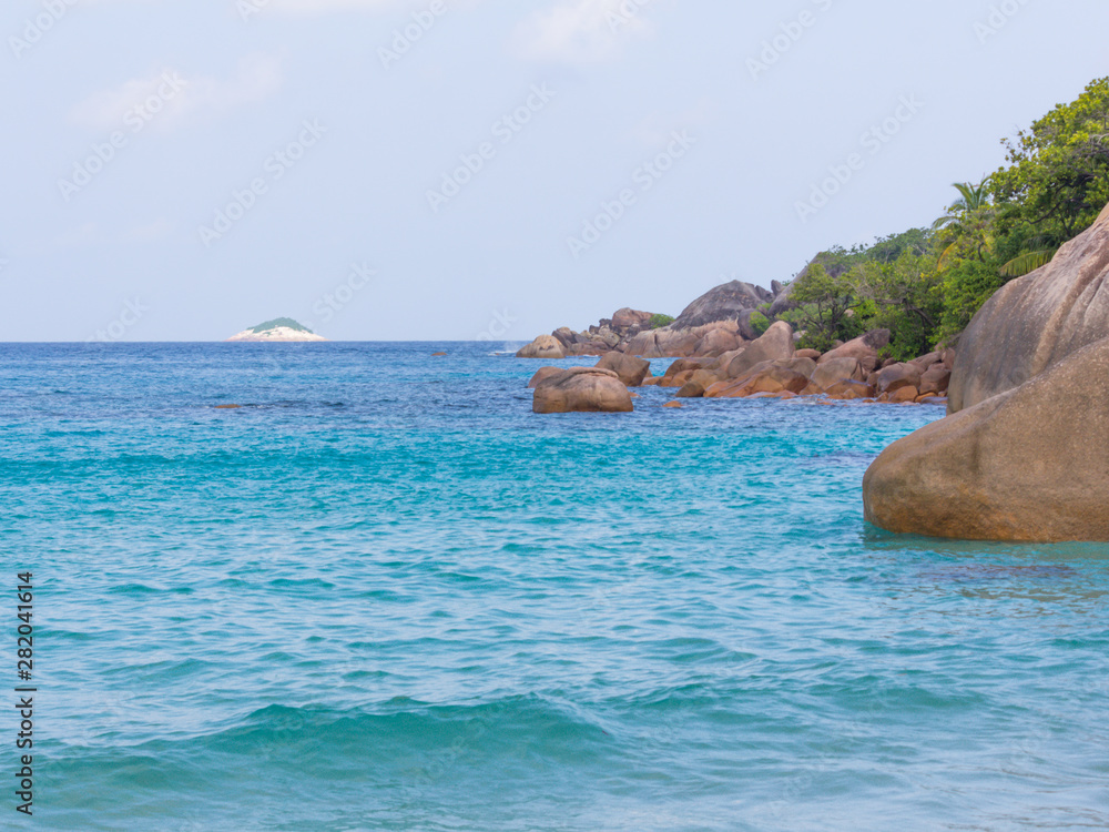 Fototapeta premium Beautiful beach with big rock and tree