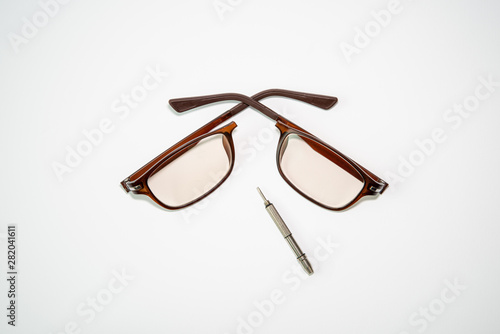 Broken glasses and repair tools