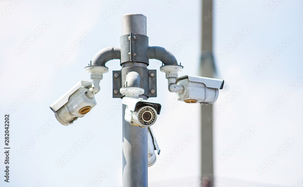 CCTV cameras installed at the corner Background sky. CCTV cameras installed at the corner Background sky.