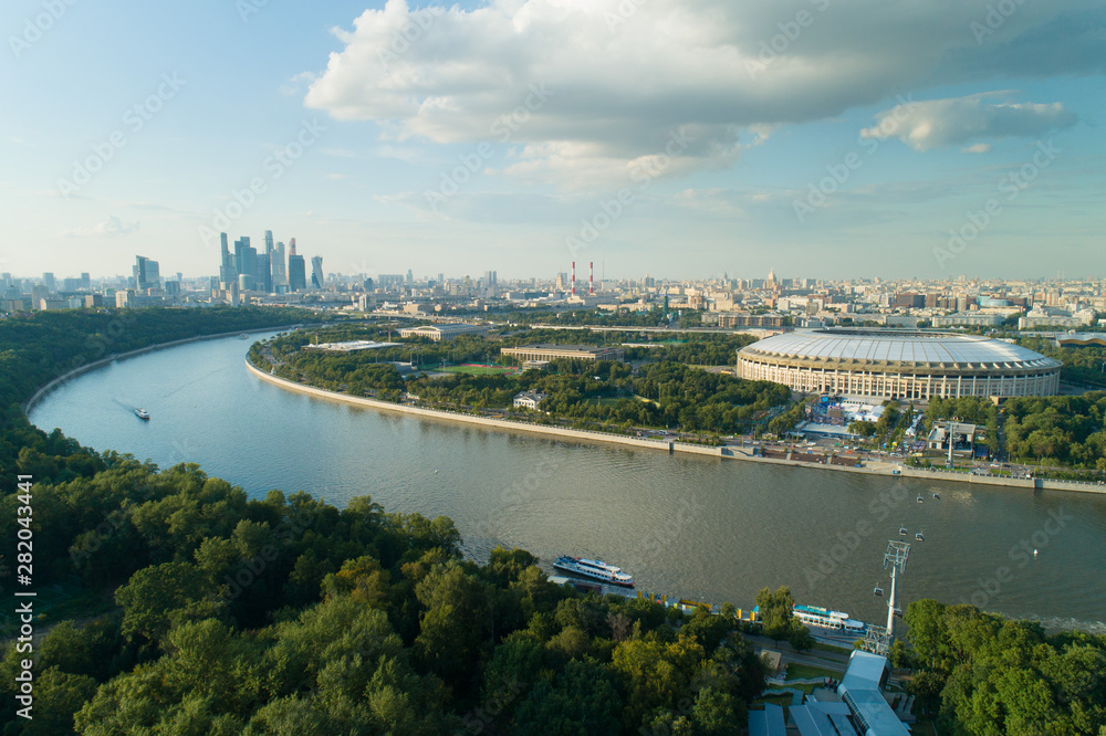 Fototapeta premium aerial view of moscow river cityscape and stadium