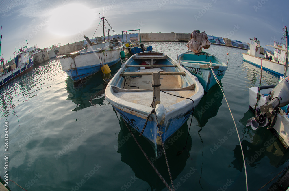 Fishing boats at old Jaffa port. Fisheye photo Fishing boats at old Jaffa port. Fisheye photo