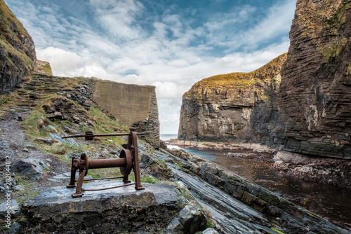 Old winch at Whaligoe Harbour in Scotland photo