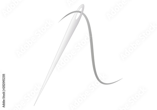 Aguja de acero con hilo para enhebrar.