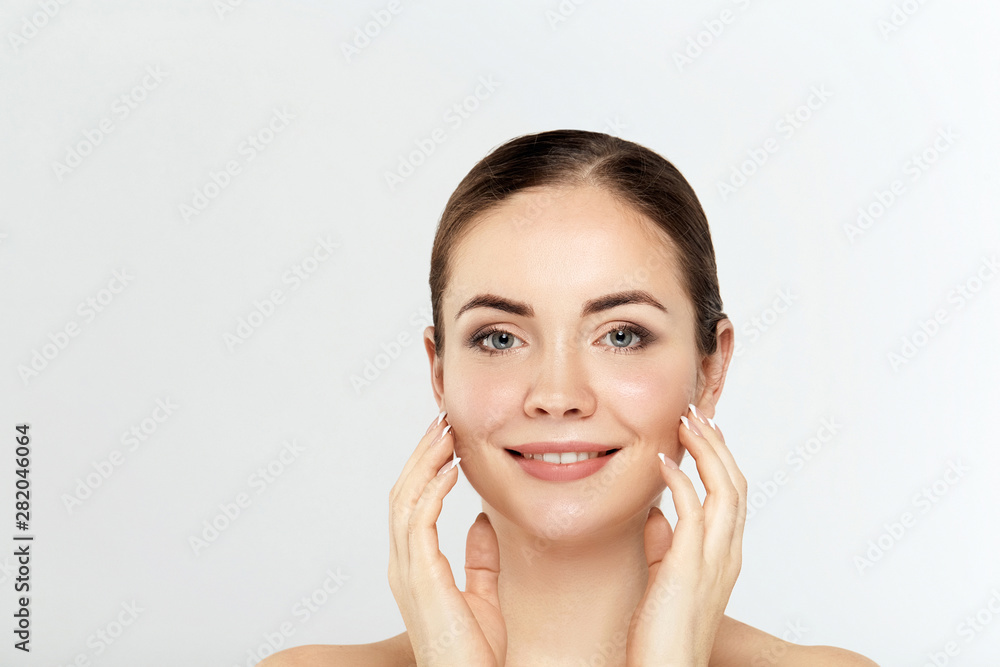 Beautiful Young Woman with Clean Fresh Skin. Facial treatment. Cosmetology. Beauty and spa. Nice and attractive girl with a pleasant smile. Beautiful Young Woman with Clean Fresh Skin. Facial treatment. Cosmetology. Beauty and spa. Nice and attractive girl with a pleasant smile.