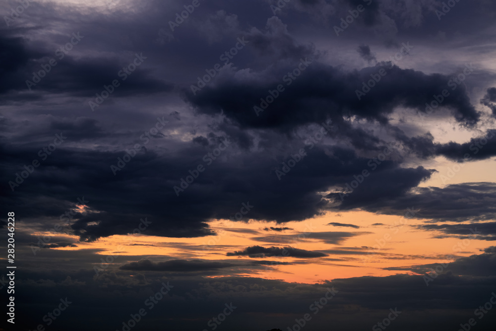 Fototapeta premium Beautiful sunset - dark sky with clouds and sunlight