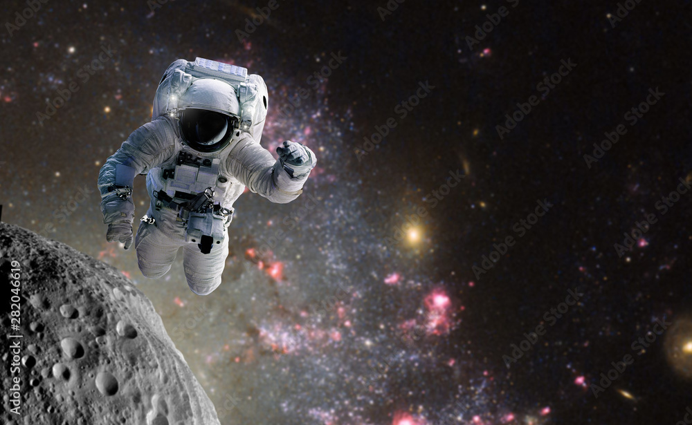 Naklejka premium Concept of conquering the universe by the human race. Elements of this image furnished by NASA